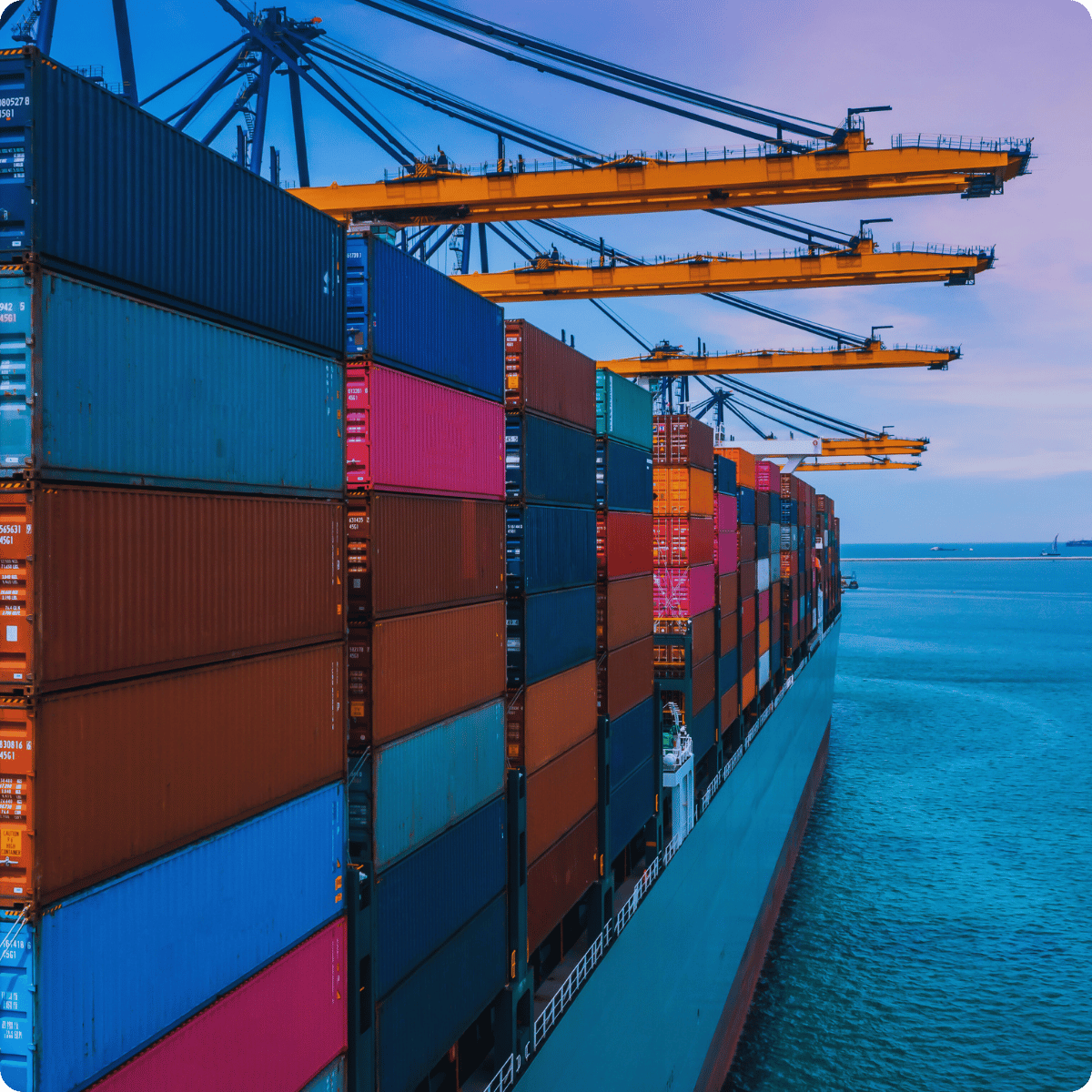Docked ship carrying multicolored shipping containers for cargo shipping